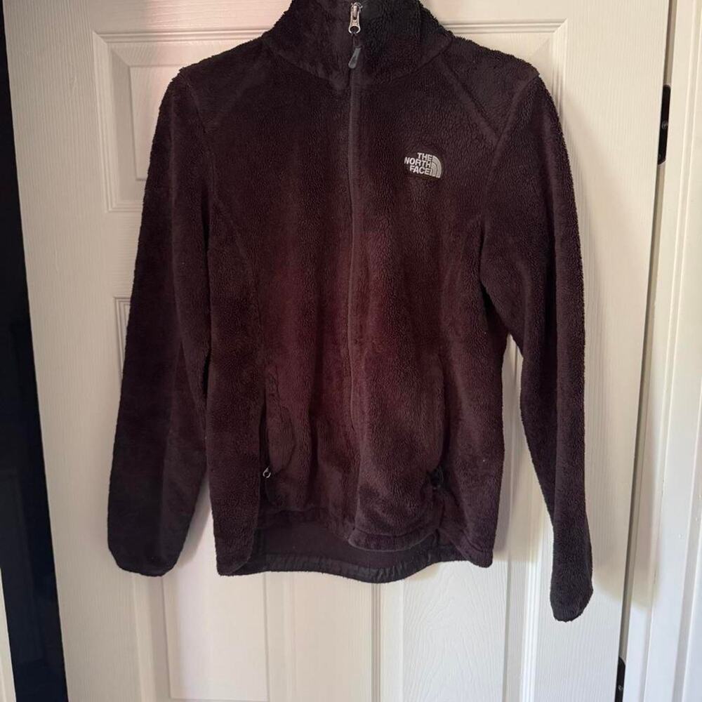 The North Face black fuzzy jacket w/ a patch on front chest and on back- Size S